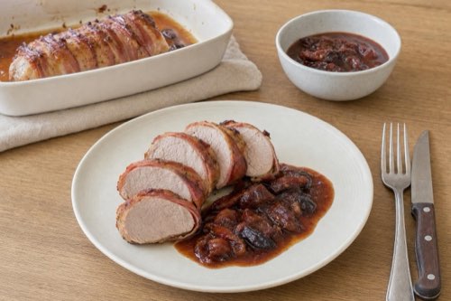 Bacon-wrapped pork tenderloin with plum sauce