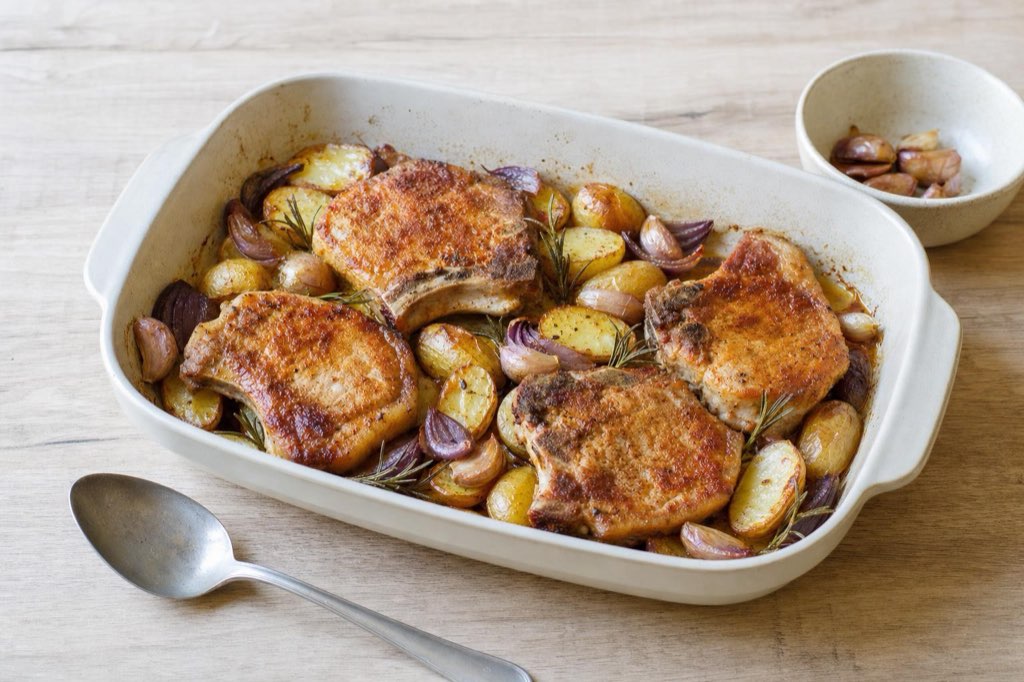 Sheet-pan pork chops with new potatoes and garlic