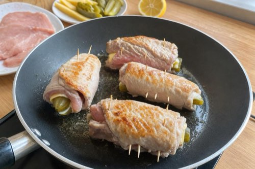 Pork rolls stuffed with pickles and cheese