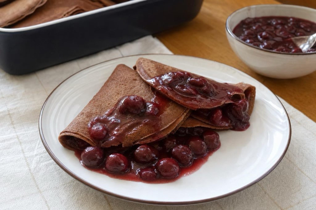 Chocolate crepes with brandy sour cherry sauce