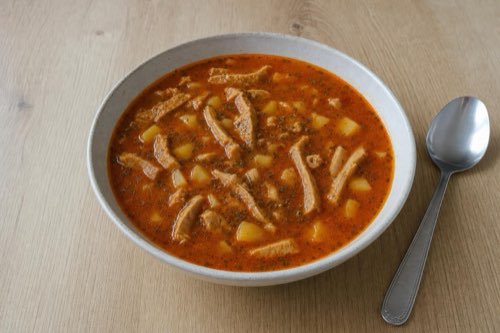 Beef tripe soup with paprika and potatoes