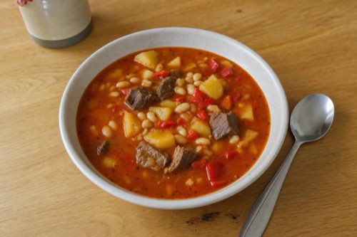Beef and bean soup with red bell pepper