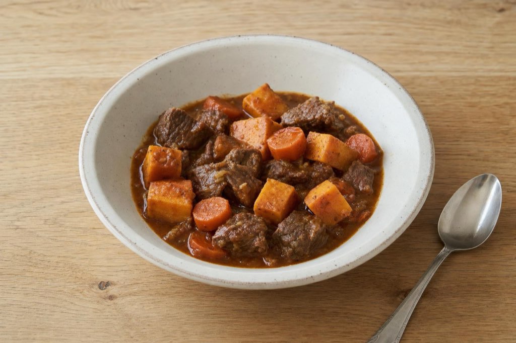Beef stew with sweet potatoes, carrots and thyme