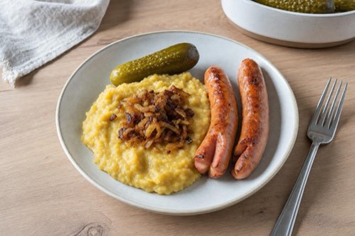Yellow split pea mash with frankfurters and onions