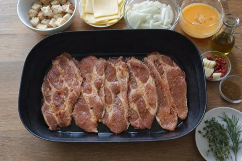 Marinated pork neck with stuffing and cheese