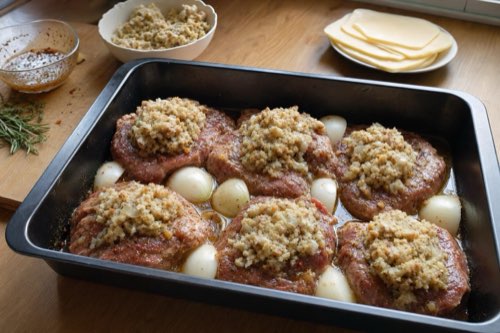Marinated pork neck with stuffing and cheese