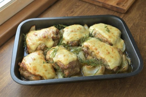 Marinated pork neck with stuffing and cheese