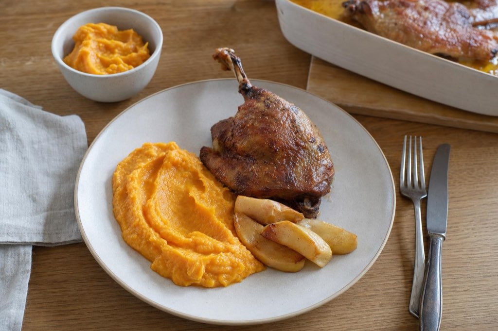 Duck legs with sweet potato puree and roasted apples