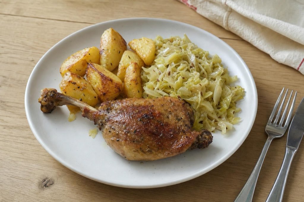 Duck legs with braised savoy cabbage and potatoes