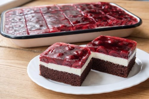 Cocoa cake with quark cream and cherries in jelly
