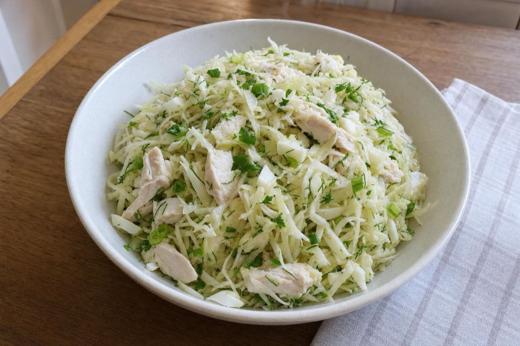Cabbage salad with chicken, celery root and dill