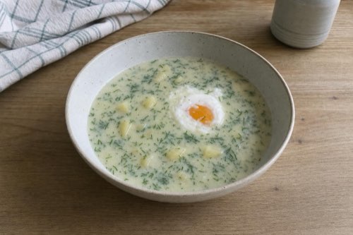 Tangy dill soup with poached eggs: add fresh dill after cooking