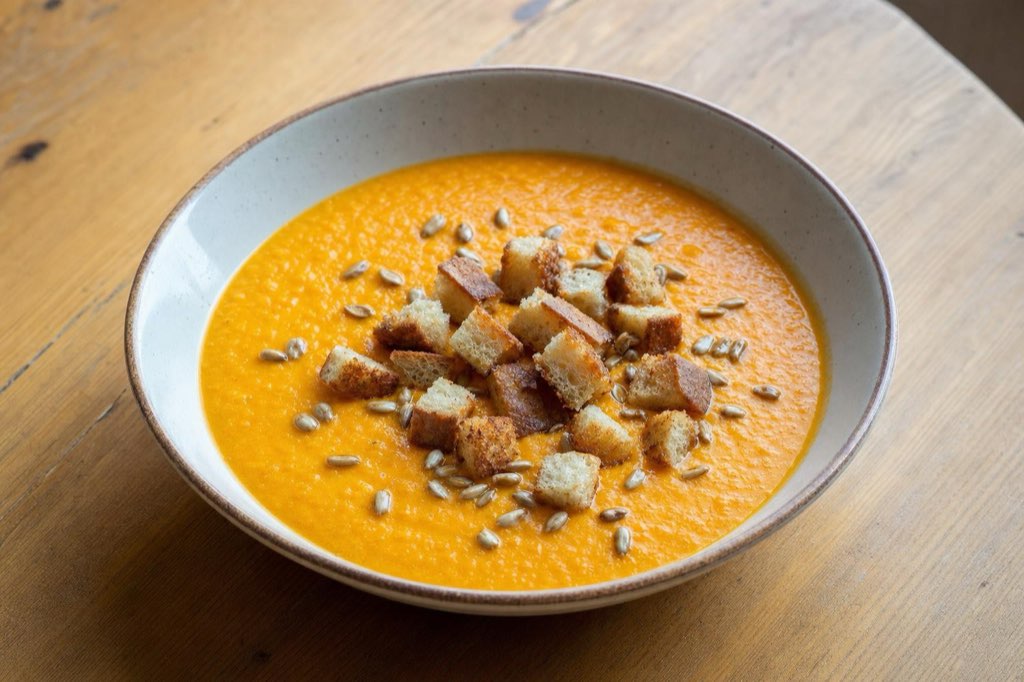 Creamy sweet potato soup with ginger and croutons