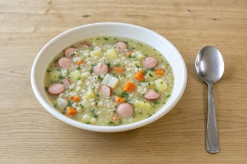 Barley soup with frankfurters and root vegetables