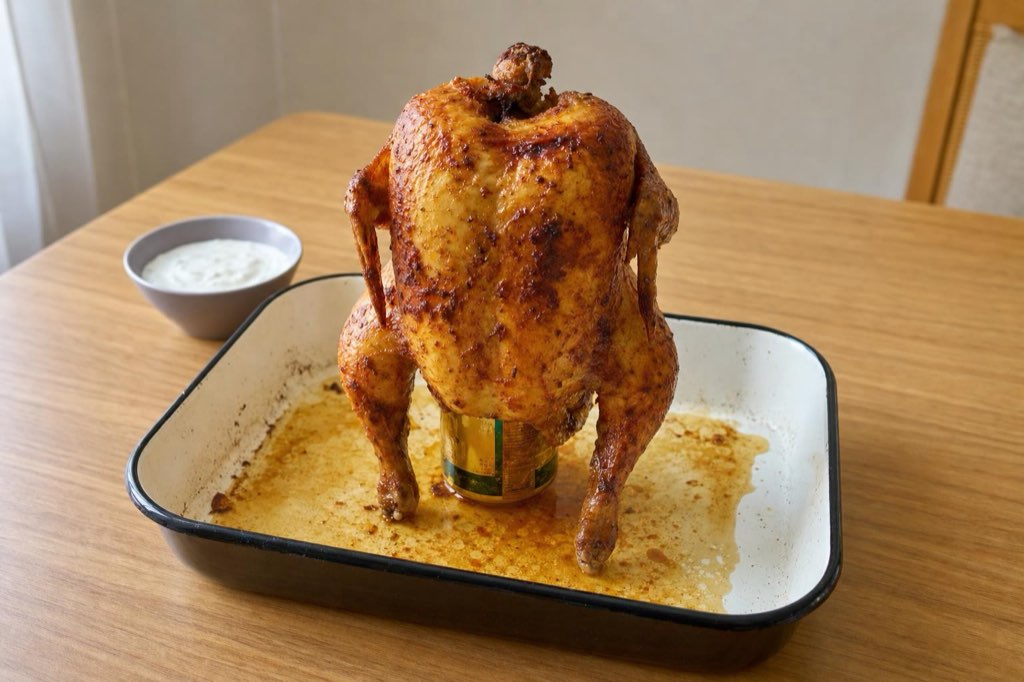 Oven-roasted beer can chicken with garlic yogurt
