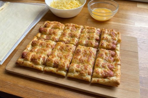 Cheesy hot dogs in woven puff pastry