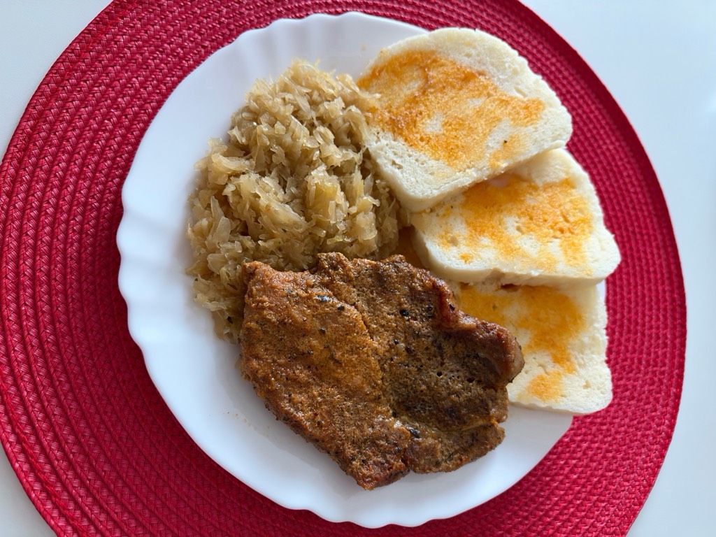 Roasted pork collar steaks with braised sauerkraut