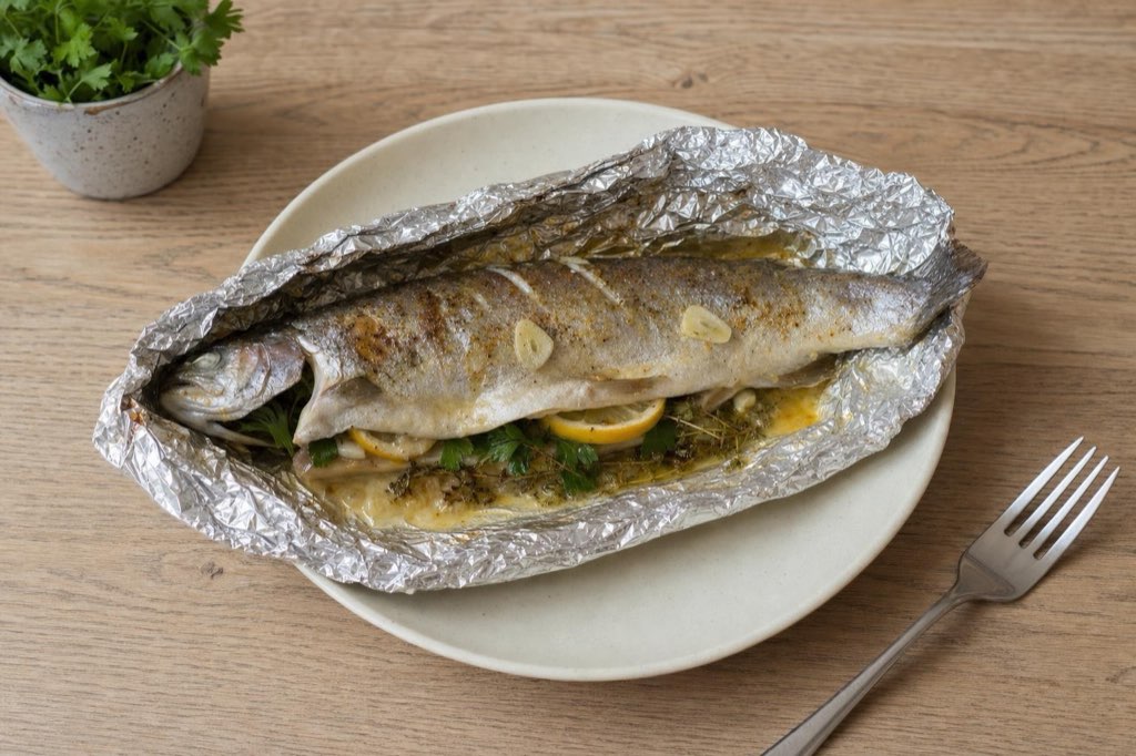 Foil-baked trout with lemon, garlic and herbs
