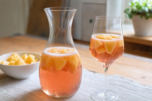 Sparkling wine cocktail with melon
