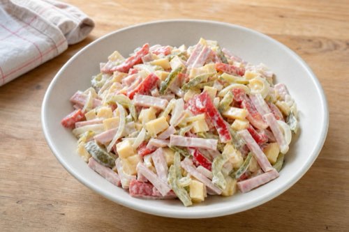 Swiss cheese and ham salad with peppers and pickles