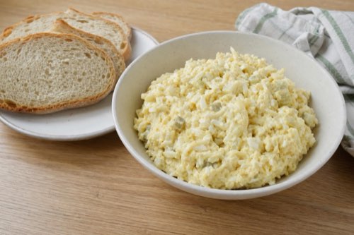 Egg and potato salad with pickles and mustard
