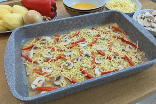 Layered chicken with potatoes and mushrooms