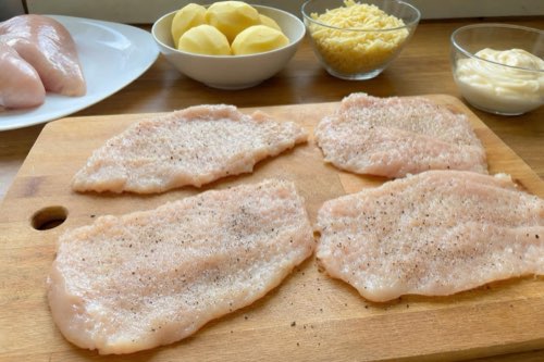 Baked chicken breasts with potatoes, cheese and mayonnaise