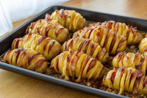 Hasselback potatoes with cheese, bacon and smoked sausage